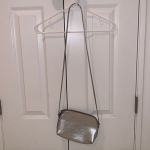 Silver leather material crossbody bag.